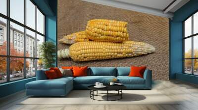 Peeled Maize or Corn on Burlap Fabric Background Wall mural