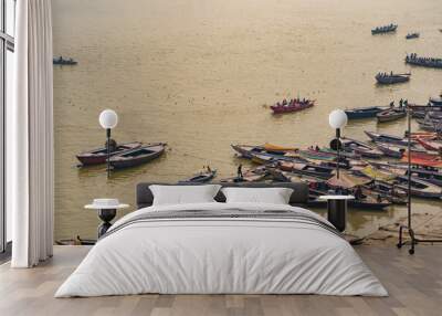 Ghats of the Ganges river with big, small running boats in Varanasi. Aerial view of Varanasi ghats Wall mural