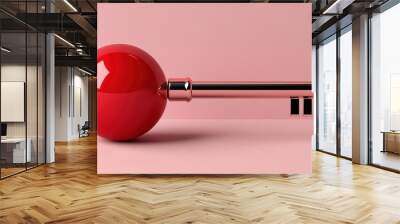 A modern red key design featuring a round handle against a soft pink background, symbolizing creativity and innovation. Wall mural