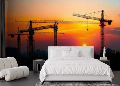 Silhouettes of Construction Cranes at Sunset Wall mural