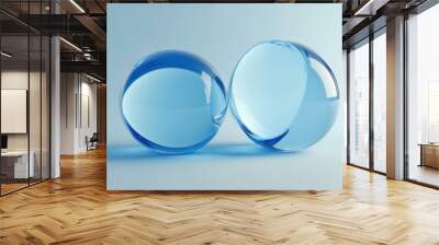 Two Blue Glass Spheres on a Blue Background Wall mural