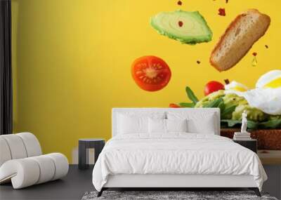 A vibrant and tasty breakfast scene featuring fresh ingredients like avocado, eggs, and tomatoes on toast against a bright yellow background. Wall mural