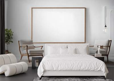 Two armchairs in room with white wall and big frame poster on it Wall mural