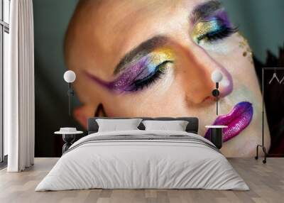 Closeup glamorous portrait of gender fluid person wearing bright makeup, eyes closed Wall mural