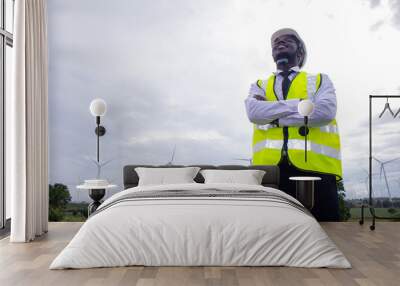 African engineer standing with wind turbine Wall mural