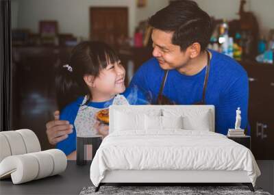 Father and daughter preparing homemade pizza with smile and happy Wall mural