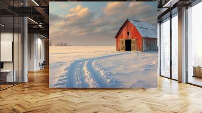 Red barn in a snowy landscape at sunset. Wall mural