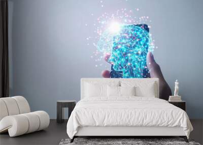 Smartphone screen displaying a hologram of a human brain on a white background Wall mural