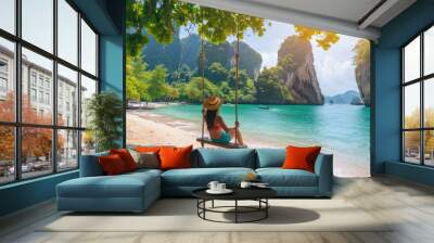 Woman sitting on a swing on a tropical beach in Krabi, Thailand Wall mural