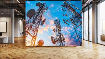 Telecommunication network infrastructure displayed with cell towers fiber optic cables and satellite communication in a setting of advanced communication technology Wall mural