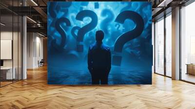 A man stands in front of a wall of many questions Wall mural