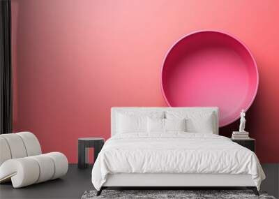 A pink bowl is on a pink background Wall mural