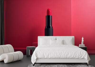 A red lipstick is displayed on a red background Wall mural