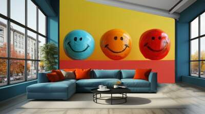 Three smiling faces are painted on three different colored balls Wall mural