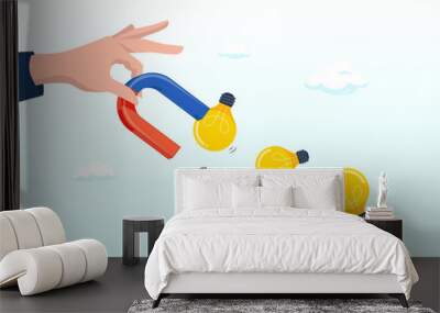 Businessman hand holding magnet to magnetize or draw light bulb lamp ideas, imagination to create new ideas, creativity or innovation for new business concept (Vector) Wall mural