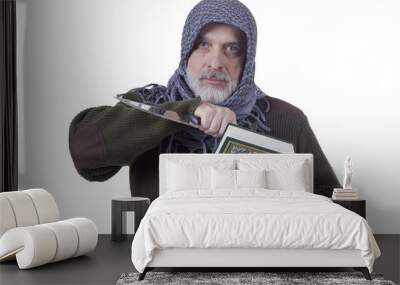 Muslim man with a Koran and a knife Wall mural