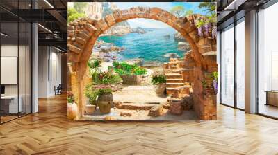 An old stone arch with a view of the seascape. Wallpaper on the wall. Wall mural