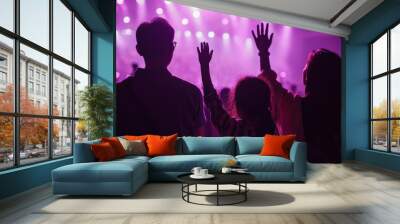 Christian family raised hands to praise God in church worship concert concept for religion, worship, prayer heaven after life Wall mural