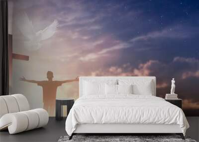 Silhouette jesus christ crucifix on cross on calvary sunset background concept for good friday he is risen in easter day, good friday worship in God, Christian praying in holy spirit religious.. Wall mural