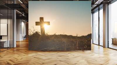 Silhouette jesus christ crucifix on cross on calvary sunset background concept for good friday he is risen in easter day, good friday worship in God, Christian praying in holy spirit religious. Wall mural