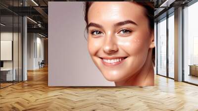 Woman smiling while touching her flawless glowy skin with copy space for your advertisement, skincare Wall mural