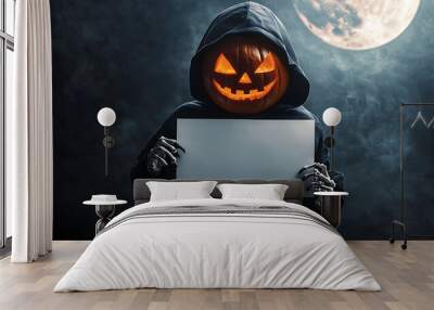 A person wearing a hooded cloak with a jack-o'-lantern face holding a blank sign. Wall mural