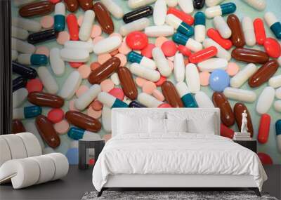 Different colorful many pills in abstract style. Healthy background. Health care, medical concept. Blue background. Wall mural