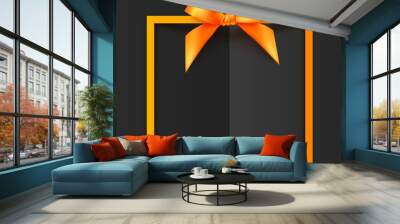 Orange vector gift box frame with silky bow and ribbon on black folded paper background Wall mural