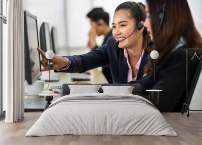 Group of happy call center smiling business operator customer help support team phone services agen working and talking with headset on desktop computer at call center office Wall mural