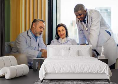 Group of professional medical doctor team meeting training medical in uniform working discussing and talk with patients record, teaching medic team, sit in hospital.health medical care concept Wall mural