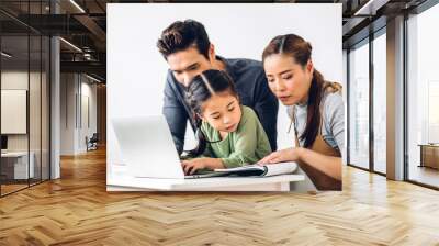 Portrait enjoy happy smiling love asian family father and mother with little asian girl learning and looking at laptop computer studying with online education e-learning system with teacher at home Wall mural