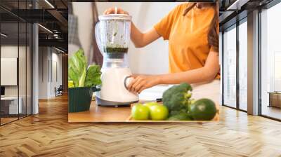 Portrait of beauty healthy asian woman making green vegetables detox cleanse and green fruit smoothie with blender.young girl drinking glass of smoothie, fiber, chlorophyll in kitchen.Diet, healthy Wall mural