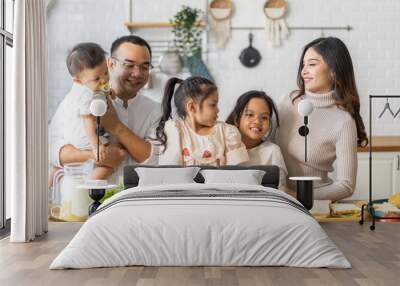 Portrait of enjoy happy love asian family father and mother with little asian girl daughter child having fun help cooking food healthy eat together with fresh vegetable salad and sandwich in kitchen Wall mural