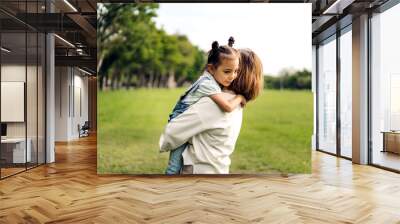 Portrait of happy love asian grandmother and asian little cute girl enjoy relax in summer park.Young girl with their laughing grandparents smiling together.Family and togetherness Wall mural