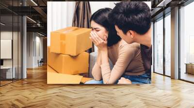 Portrait of upset couple serious quarrel together on sofa at home Wall mural