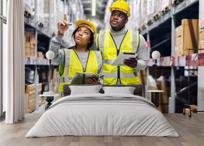 Portrait two african american engineer team shipping order detail on tablet check goods and supplies on shelves with goods inventory in factory warehouse.logistic industry and business export Wall mural