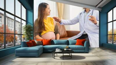 Pregnant asian woman smiling receiving vaccination from senior male doctor prenatal care, healthcare, pregnancy support, expecting mother, vaccine injection, medical consultation, maternity health Wall mural