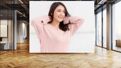 Smiling of cheerful beautiful pretty asian woman clean fresh healthy white skin posing in warm knitted pink clothes.Girl felling relaxing and enjoy time on the bed at home.asia beauty Wall mural