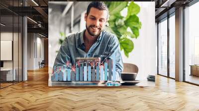 Success hipster man relaxing use digital tablet look at screen progress of business money financial investment funds and digital asset data graph and chart business growth increase at cafe Wall mural