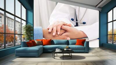 Woman doctor service help support discussing and consulting talk to man patient and holding hands at meeting health medical care express trust concept in hospital.healthcare and medicine Wall mural