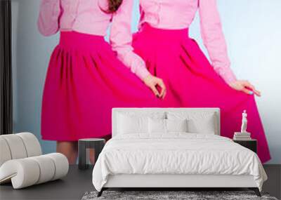 Cute young women in a pink clothes Wall mural