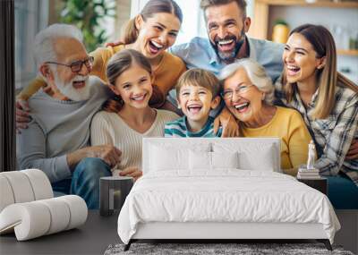 Three generations of a happy family are sitting together on a couch, smiling and bonding Wall mural