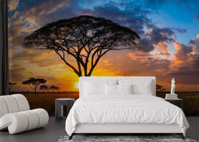 Panorama silhouette tree in africa with sunset.Tree silhouetted against a setting sun reflection on water.Typical african sunset with acacia trees in Masai Mara, Kenya. Wall mural