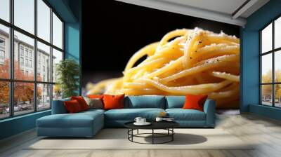 A close-up of spaghetti topped with cheese and pepper, showcasing a delicious pasta dish. Wall mural