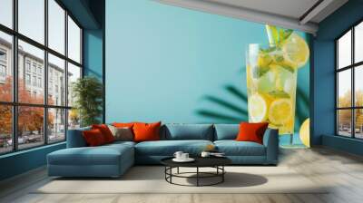 Cocktail refreshing lemon drink on summer blue background Wall mural