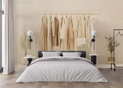 Hanging clothes collection with cream natural color on beige background Wall mural