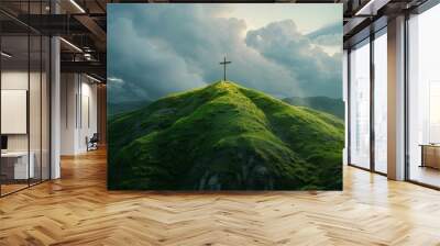 Christian cross on top of a green hill Wall mural