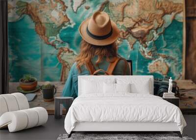 Female travelogue with map and laptop on table Wall mural