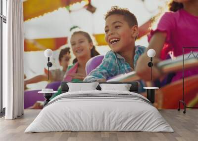 A joyful scene at a fair where children are having fun on the rides and parents are smiling as they watch them. Wall mural