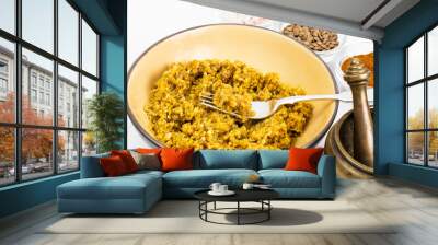 Lentil porridge with butter in a ceramic bowl on a white backgro Wall mural